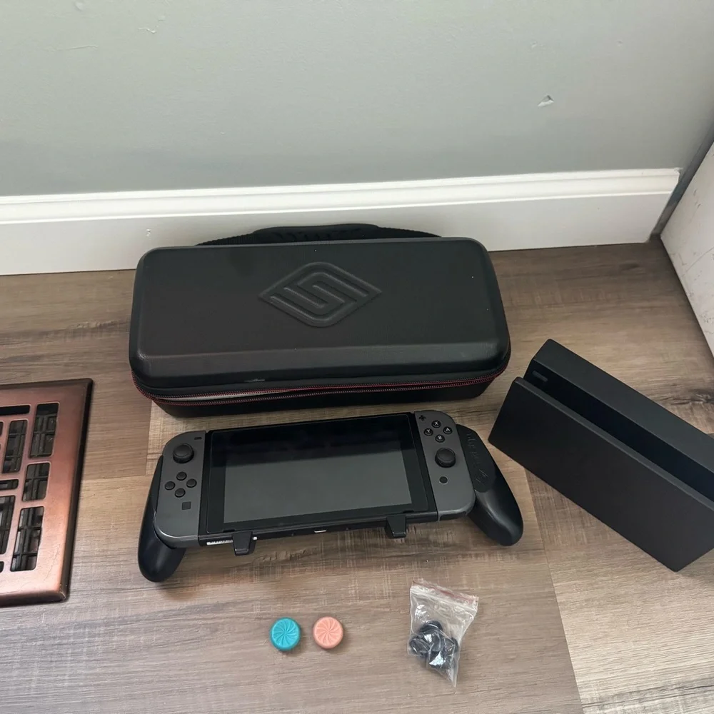 Nintendo Switch with Black and Gray Accessories
